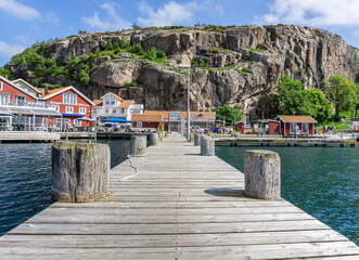 View on the village and high rocks on West coast of Sweden with colorful buildings