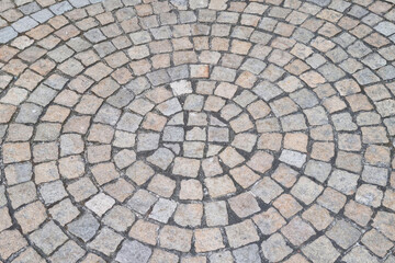 Beautiful view of the stone paving stones in the old part of the city, texture, background.