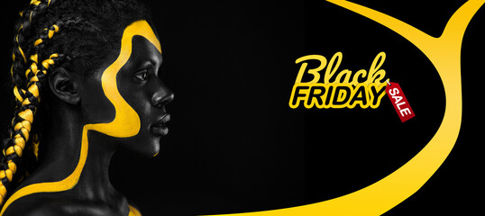 Black friday sale and shopping concept Woman with body paint. Cheerful young african girl with art bodypaint. An amazing model with yellow and black makeup.
