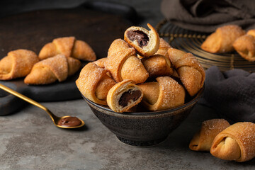 Close-up of homemade filled pastries - rugelach or kipferl. Made with butter and cream cheese...