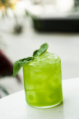 Refreshing basil cocktail served outdoors
