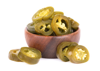 Pickled jalapeno pepper in wooden bowl, isolated on white background. Slices of preserved hot serrano.