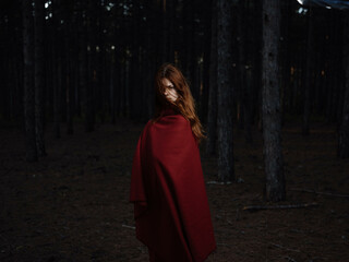 Naklejka premium woman in red plaid in the forest nature travel fresh air