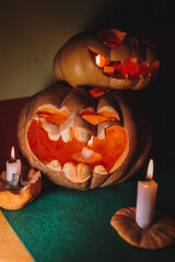 carved pumpkin faces for halloween with candles