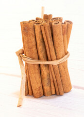 Cinnamon sticks on wooden background