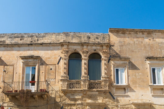 Lecce, Puglia, Italy - August 18, 2021: view of the facade of the Paladini Palace on Principi di Savoia street in the old town- detail