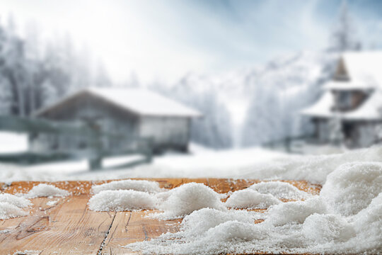 Wooden table of fresh snow and winter landscape 