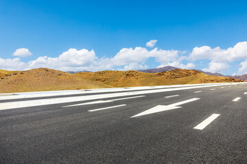 Highway ground and mountain natural scenery under blue sky.Landscape and highway.Outdoor road background.