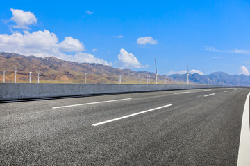 Fototapeta premium Highway ground and mountain natural scenery under blue sky.Landscape and highway.Outdoor road background.