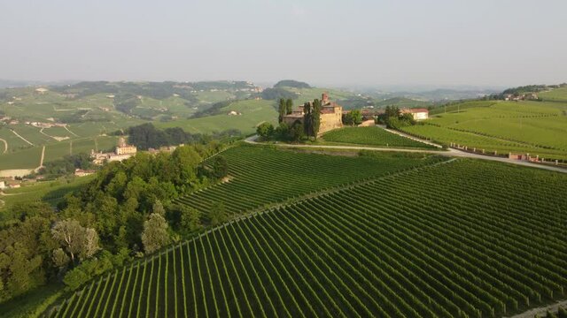 La Volta and Falletti castles aerial view situated in Barolo, Langhe region, Piedmont (Piemonte), Northern Italy. Famous Italian castle tourism travel destination in Europe. Surrounded by vineyards.