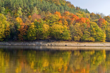 Autumn lake and forest, landscape. Lazberc, Hungary. 