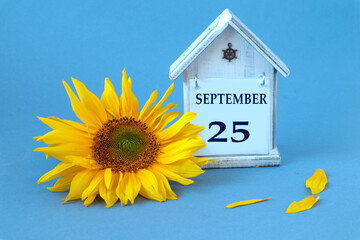 Calendar for September 25 : decorative house with the name of the month in English, number 25,...