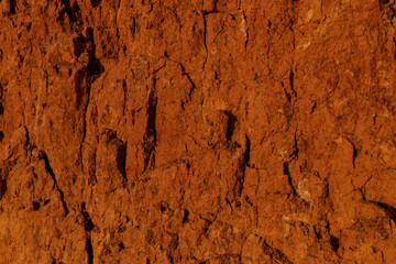 Geology. Desert landscape. Panorama view of the sandstone formation, the rocky cliffs, sand. Background or texture of sandy cliff on the coast, orange limestone