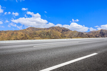Highway ground and mountain natural scenery under blue sky.Landscape and highway.Outdoor road...