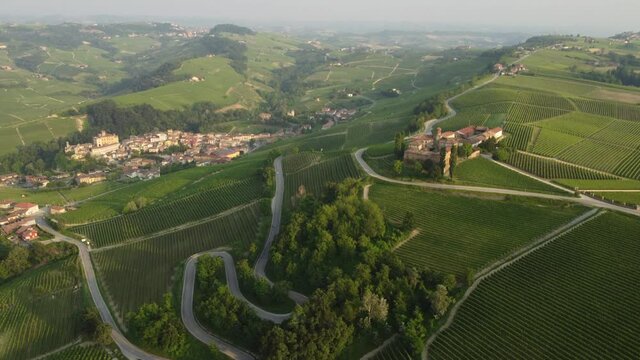 La Volta and Falletti castles aerial view situated in Barolo, Langhe region, Piedmont (Piemonte), Northern Italy. Famous Italian castle tourism travel destination in Europe. Surrounded by vineyards.