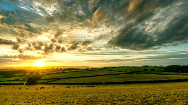 Sunset over the fields in Time Lapse Movie, Berry Pomeroy Village in Devon, England, Europe