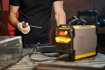 welding machine in male hands close. selective focus