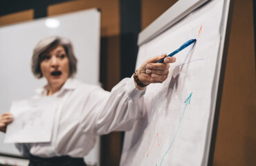 Concentrated woman making presentation during work