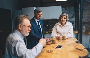 Colleagues having coffee break in office