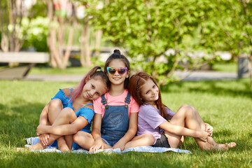 cute children girls playing together in the park