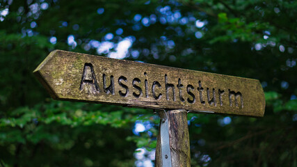 wood sign lookout tower. signpost in the right direction