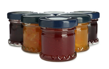 Jars with different jams on white background