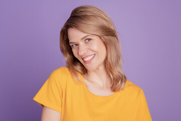 Fototapeta premium Photo of cheerful young pretty lovely woman happy positive smile isolated over purple color background