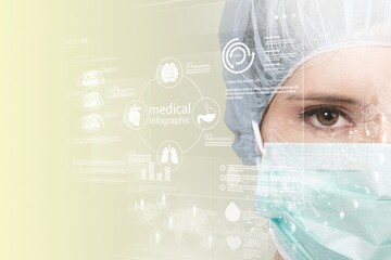 female scientist with face mask looking at data on a transparent digital screen