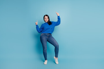 Full size photo of young attractive girl dancing have fun discotheque music isolated on blue...
