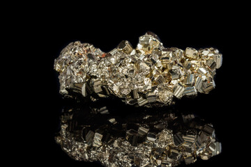 Macro mineral stone Pyrite on a black background
