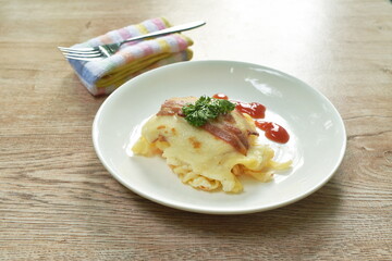 baking toast topping egg chicken sausage and cheese dressing sauce eat couple salad on plate eat couple black coffee