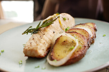 tasty salmon, mash potato and vegetable on plate 
