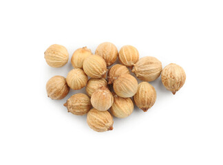 Heap of dried coriander seeds on white background, top view