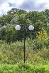 Vintage iron lantern in a public park in the daytime