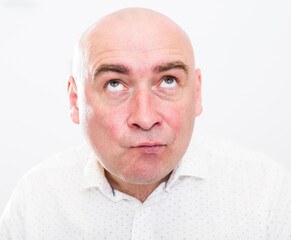 portrait of bald adult mature man with emotions on white background