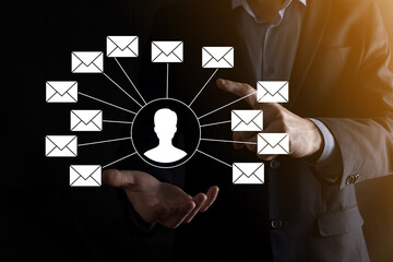 Male hand holding letter icon,email icons .Contact us by newsletter email and protect your personal information from spam mail. Customer service call center contact us.Email marketing and newsletter