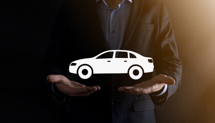 Digital composite of Man holding car icon.Car automobile insurance and car services concept....