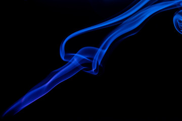 Abstract colored smoke moves on dark background. Wallpaper. Personal vaporizers fragrant steam. Concept of alternative non-nicotine smoking. E-cigarette. Texture. Design elements.