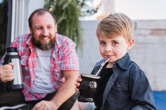 Charming boy with mate against smiling father