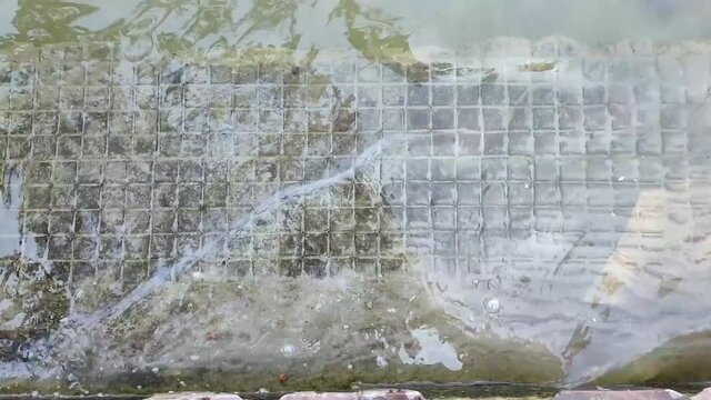 The steps are covered with water. Descent to the river on the city embankment