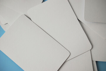 Blank playing card mock up. Six white cards on a wooden background.