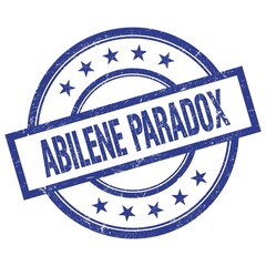 ABILENE PARADOX text written on blue vintage round stamp.