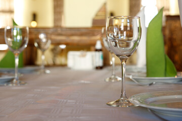 Empty glasses are on the table. A fragment of the serving.