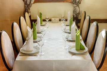 Empty glasses are on the table. A fragment of the serving.