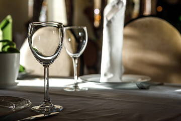 Empty glasses are on the table. A fragment of the serving.