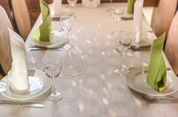 Empty glasses are on the table. A fragment of the serving.