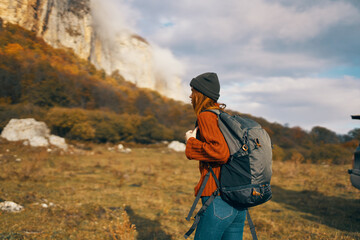 Fototapeta na wymiar woman tourist with cutter near mountains travel landscape adventure