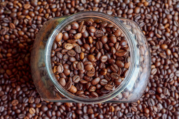 A jar completely filled with coffee beans.