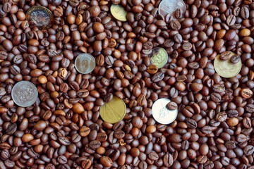 a few coins on coffee beans