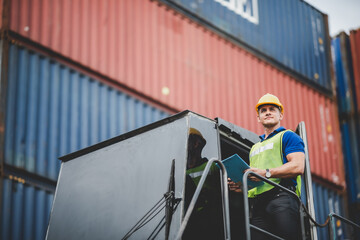 foreman or engineer are work in container shipping industry warehouse, logistic transport to import and export cargo at delivery storage port terminal, man are work to control a business box